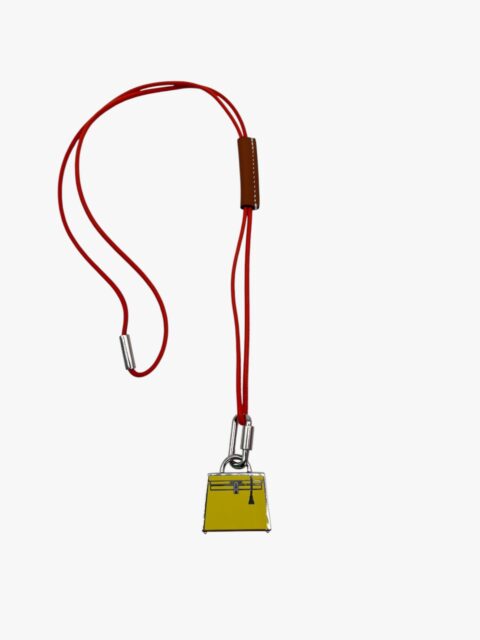HERMÈS – PENDENTE MON PETIT KELLY PALLADIO SMALTO GIALLO E PELLE SWIFT ARANCIO/GOLD